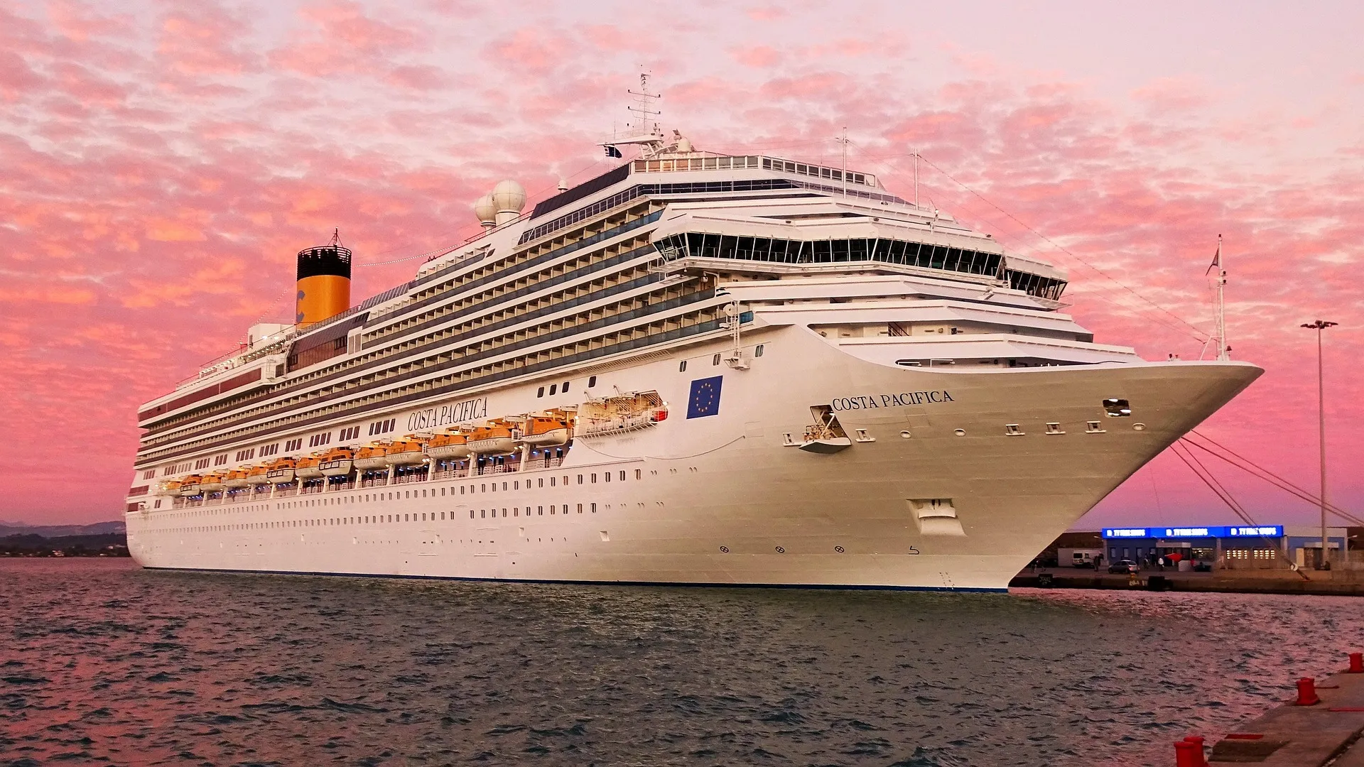A cruise ship moored in port at dusk
